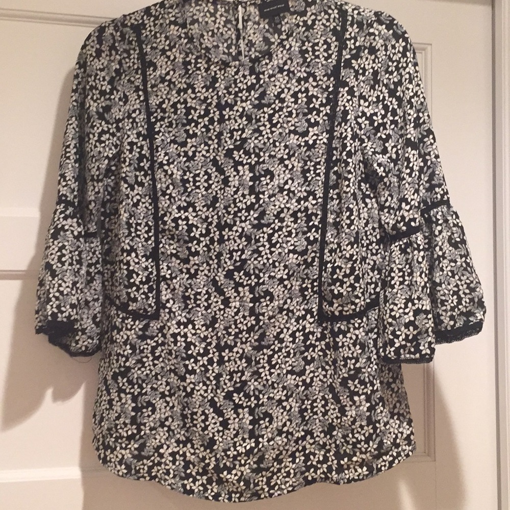 Black and white floral blouse with bell sleeves